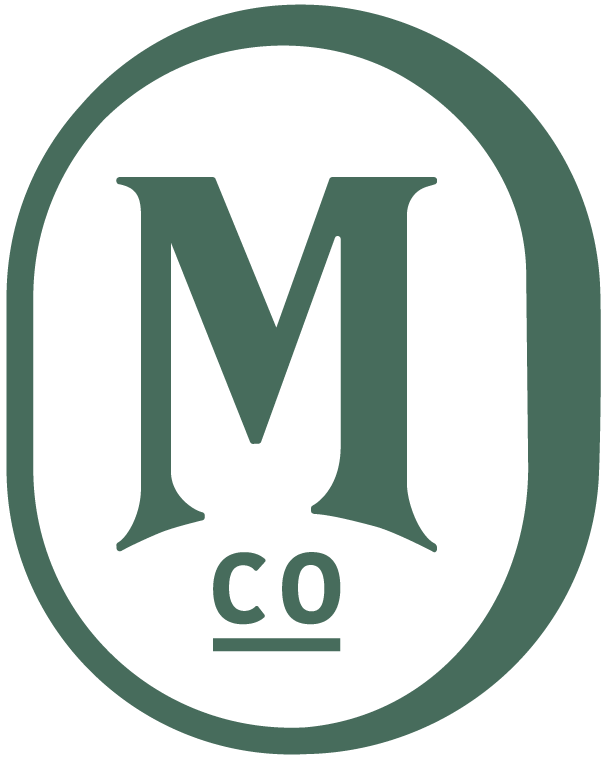 Green M Co. badge logo for The Monty Collective