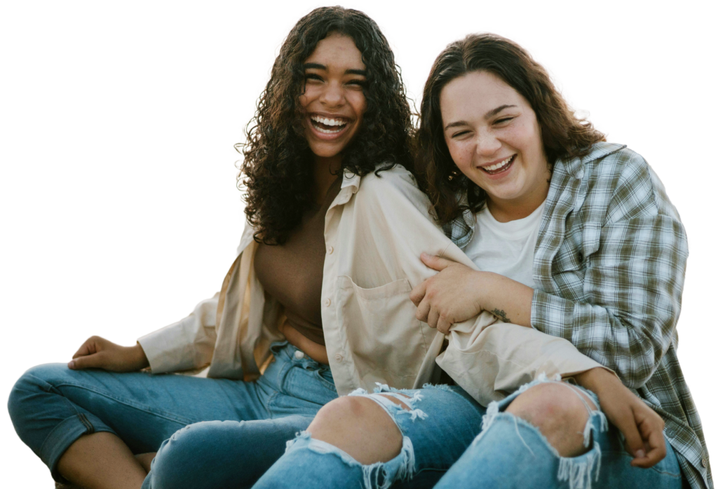 Two friends laughing together on transparent background